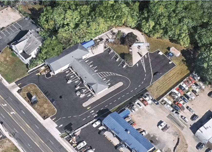 Large brushes cleaning a car.