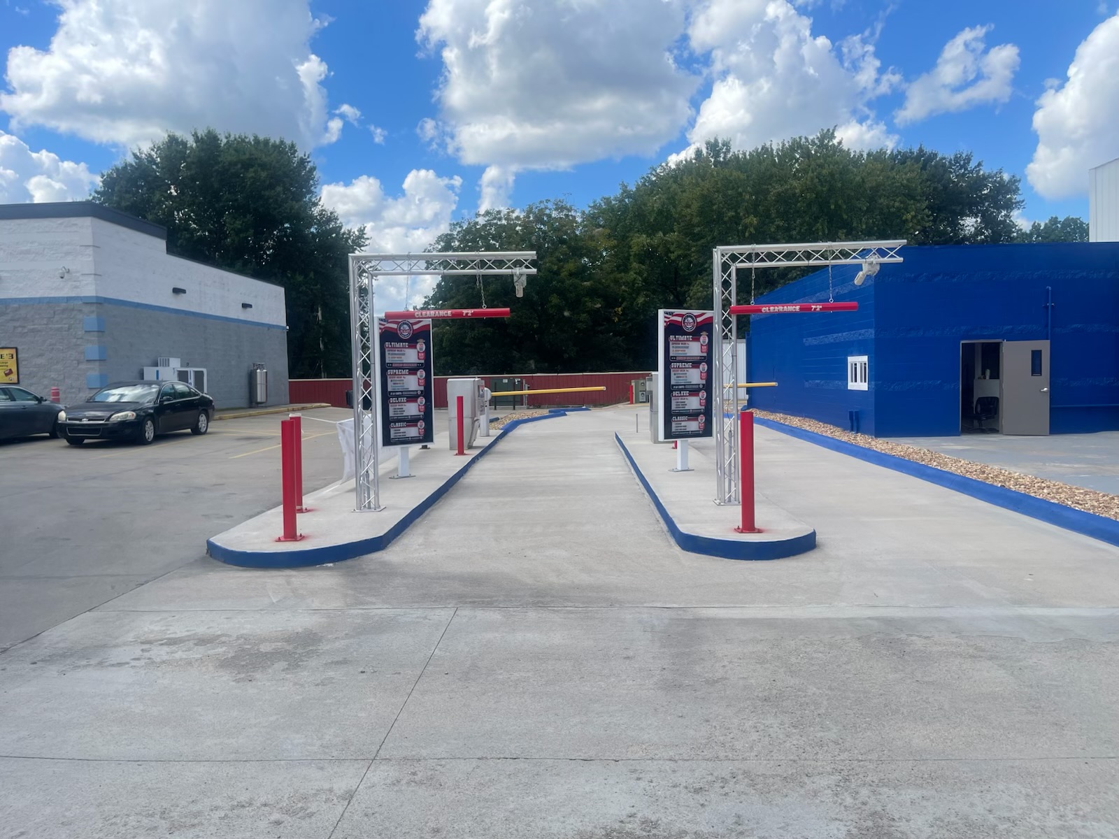 Large brushes cleaning a car.