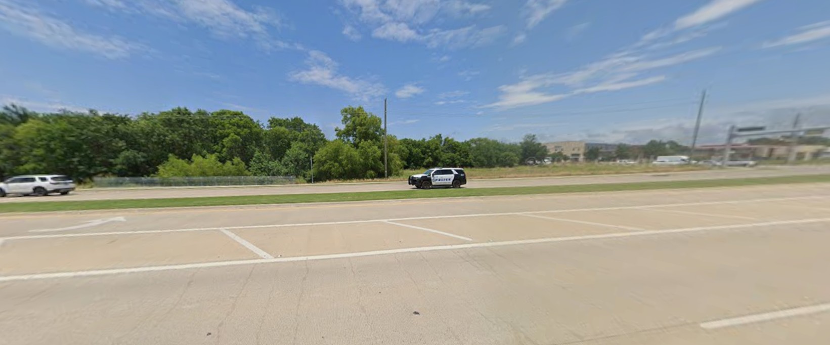 Large brushes cleaning a car.